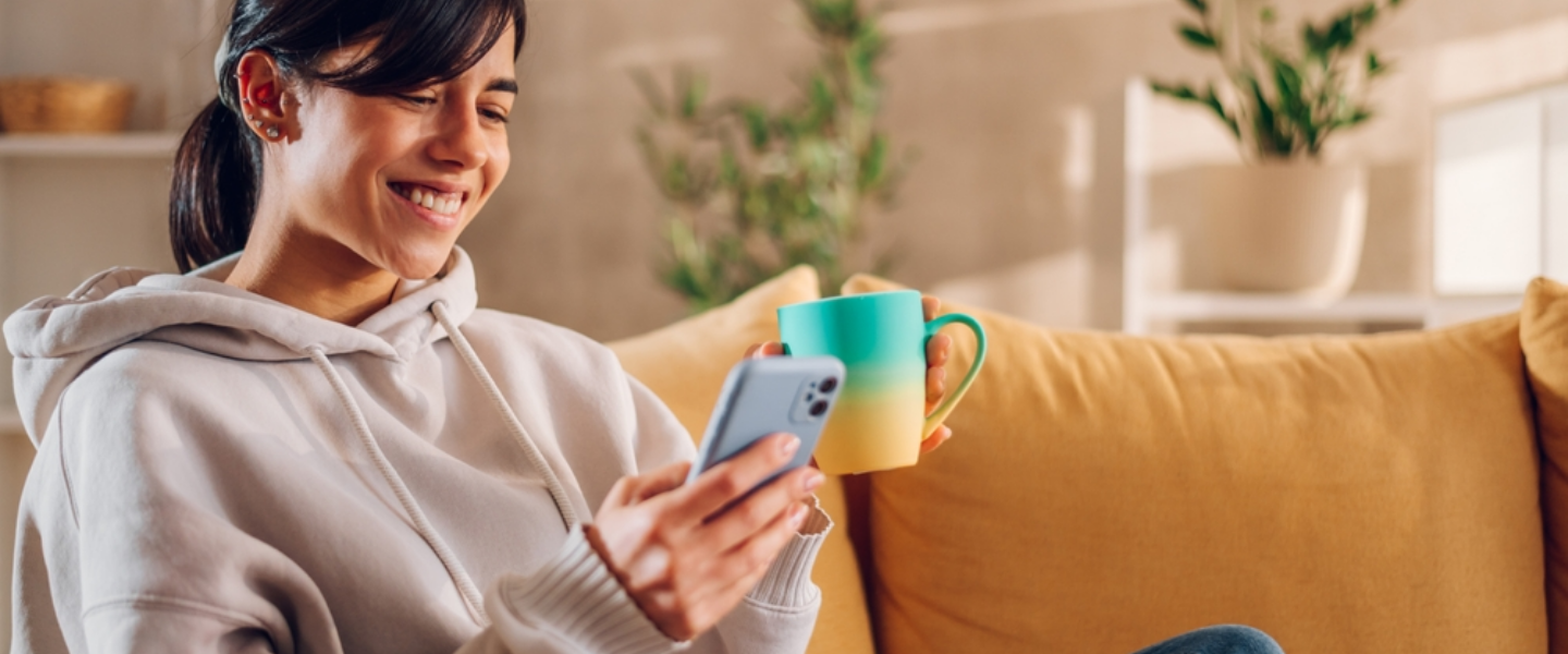 Happy female looking at phone