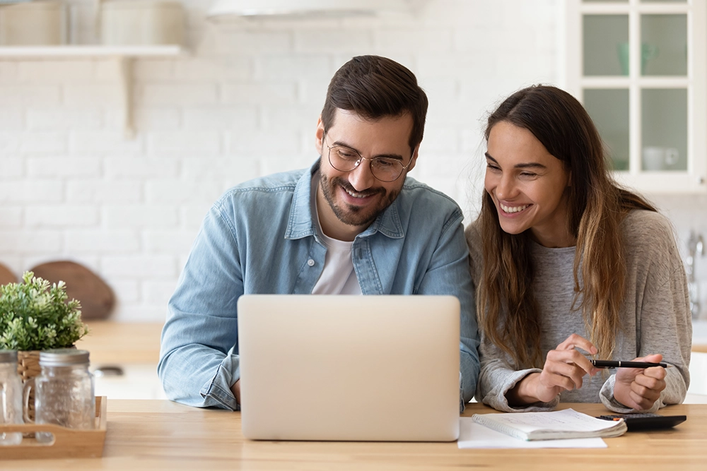 Online Loans Couple Researching A couple researching what online loan is best for them